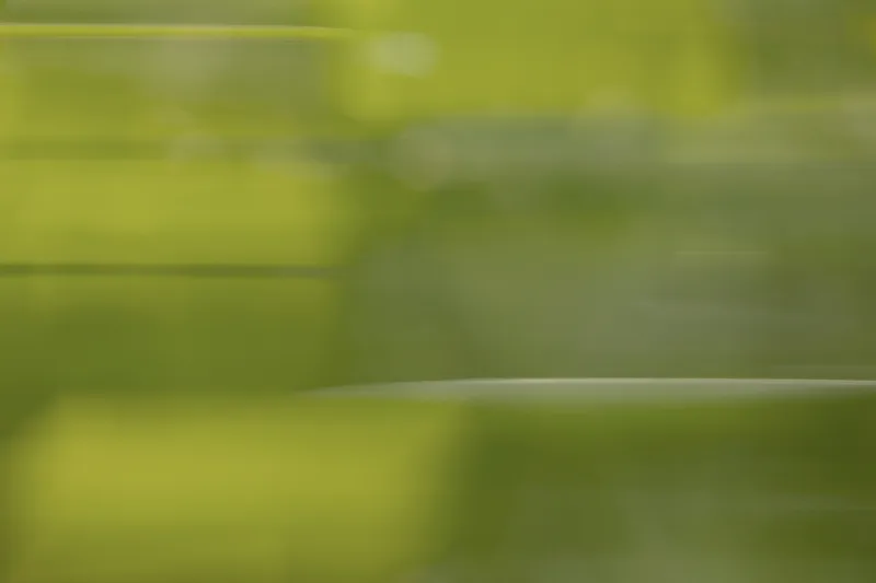 An abstract motion-blur in horizontal green streaks
